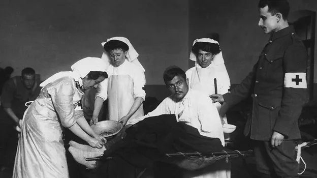 VAD nurses wore a blue dress and a white pinafore (a type of apron)